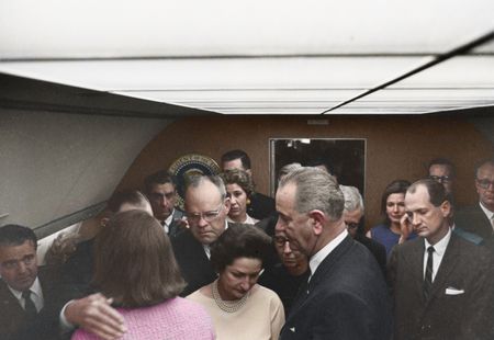 This colorized archival image shows the swearing-in ceremony of Lyndon B. Johnson (LBJ) as President aboard Air Force One, Nov. 22, 1963, in Dallas. (Cecil Stoughton/White House Photographs/John F. Kennedy Presidential Library and Museum, Boston)