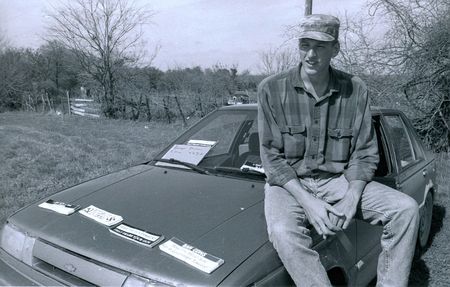 Timothy McVeigh is pictured sitting on the bonnet of his car while he was selling anti-government bumper stickers at Mount Carmel Waco, during the ATF/FBI standoff with the Branch Davidians in April,1993. (Michelle Rauch/Courtesy FBI Multimedia)