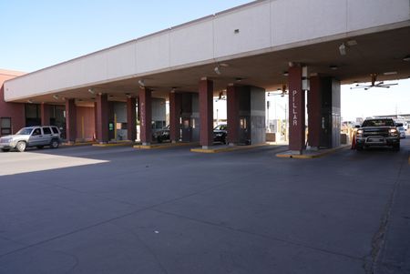 Multiple cars wait in line to pass through the booths at the El Paso border in El Paso, Texas. (National Geographic)