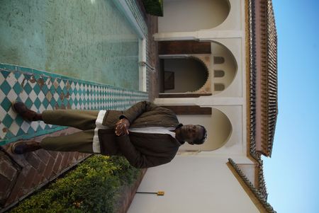 Onteka Nubio standing inside a courtyard in the Alcazaba Fort in Malaga, looking out onto Malaga city. Alcazaba was built to defend from Moorish armies in Spain. (National Geographic/Ciaran Henry)