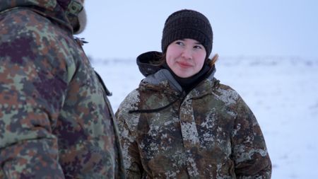 Qutan Hailstone hunts caribou with her father, Chip Hailstone. (BBC Studios/Pedro Delbrey)