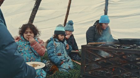 Emilie, Gilbert and their kids eat some freshly caught fish. (Blue Ant Media/Tara Elwood)