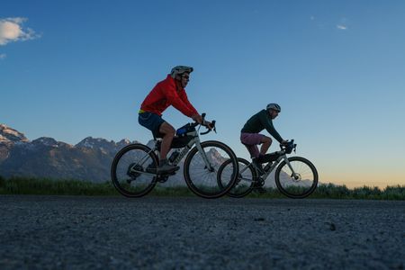 Alex Honnold and Tommy Caldwell riding through the mountains at sunset.  (National Geographic/Taylor Shaffer)