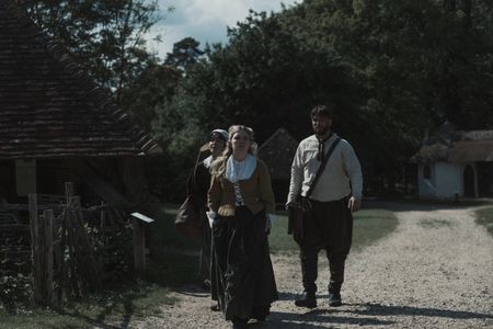 Mary Dunbar walks down a dirt road with two companions. (Dash Productions Services LTD/Antoan Ivanov)