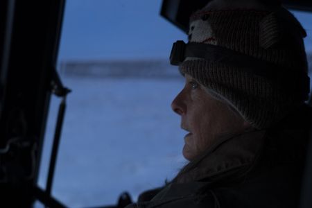 Sue Aikens looks for caribou near her camp. (BBC Studios Reality Productions, LLC/Jayce Kolinski)