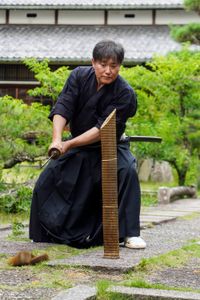 Isao Machii slices through a tatami mat with a katana.  (National Geographic/Dana Hayes)