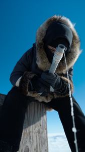 Jaxon Hoffman ice fishing. (BBC Studios Reality Productions, LLC/Brian Bitterfeld)