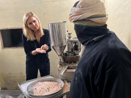 Mariana van Zeller speaks with a fake pill producer at his operation in an undisclosed village in Northern India. (National Geographic for Disney)
