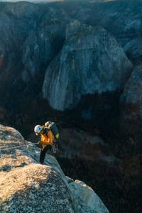 Cheyne Lempe, cinematographer, carrying a 45lb pack of camera equipment, rappelling over the edge of El Cap with 3000ft of exposure below. This was the beginning of a typical day of shooting.  (National Geographic/Jimmy Chin)