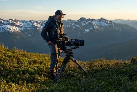 Camera Operator Rick Smith filming in the mountains. (National Geographic for Disney/Colin Arisman)