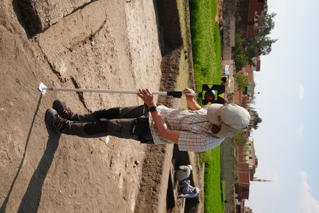 Henning Franzmeier uses a measurement device at the Pi Ramesses site in Egypt. (Windfall Films)