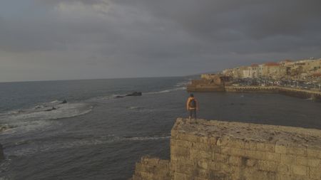 Acre, Israel - Dr. Albert Lin overlooking the lagoon in Acre, Israel. (Blakeway Productions/National Geographic)